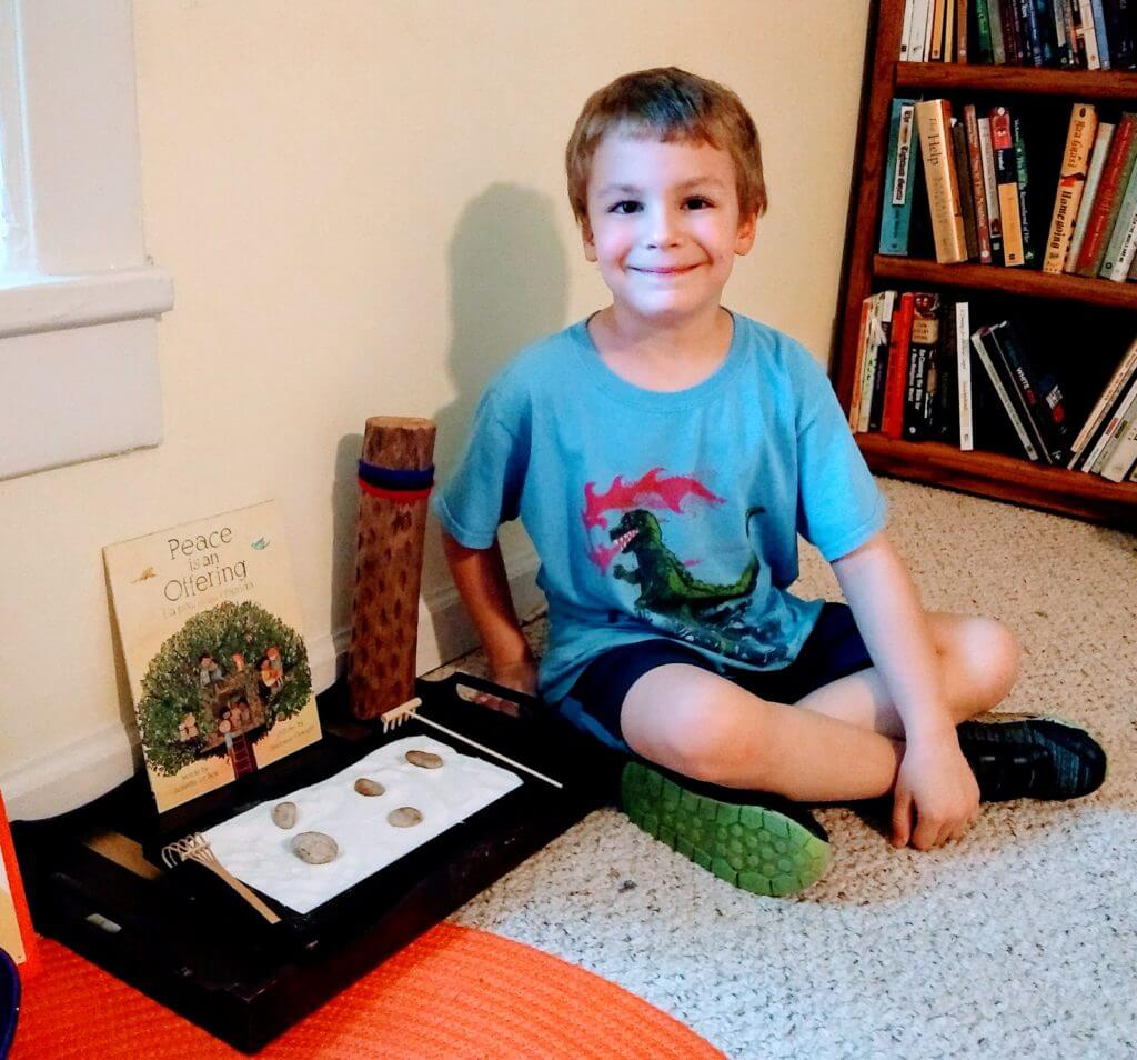 As a Mom, I've often wished I could do more to help my son calm down when he's angry. I decided to borrow a strategy from our Montessori school: creating a small peace area where he can go when he's angry, upset, or anxious. Whether you're a parent or educator, this is a great anger management strategy for kids. Click through for a full list of ideas of what to include in your peace area, plus a free set of mindfulness activities for children. #mindfulness #montessori #peaceeducation