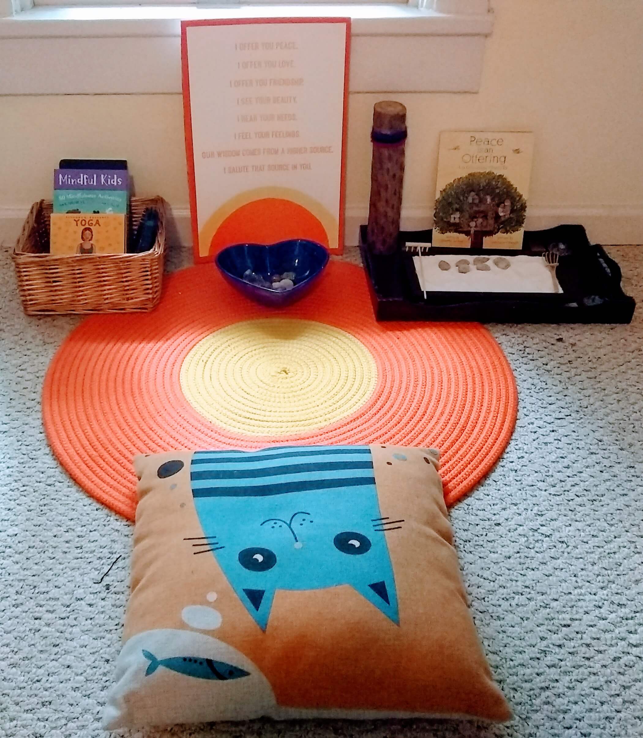 As a Mom, I've often wished I could do more to help my son calm down when he's angry. I decided to borrow a strategy from our Montessori school: creating a small peace area where he can go when he's angry, upset, or anxious. Whether you're a parent or educator, this is a great anger management strategy for kids. Click through for a full list of ideas of what to include in your peace area, plus a free set of mindfulness activities for children. #mindfulness #montessori #peaceeducation
